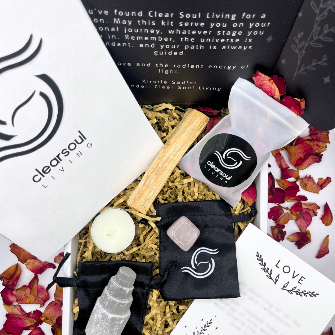 Love Kit featuring Rose Quartz, Selenite Crystal Tower, Palo Santo, rose petals and affirmation card. Designed to attract love and open your heart. Clear Soul Living packaging.