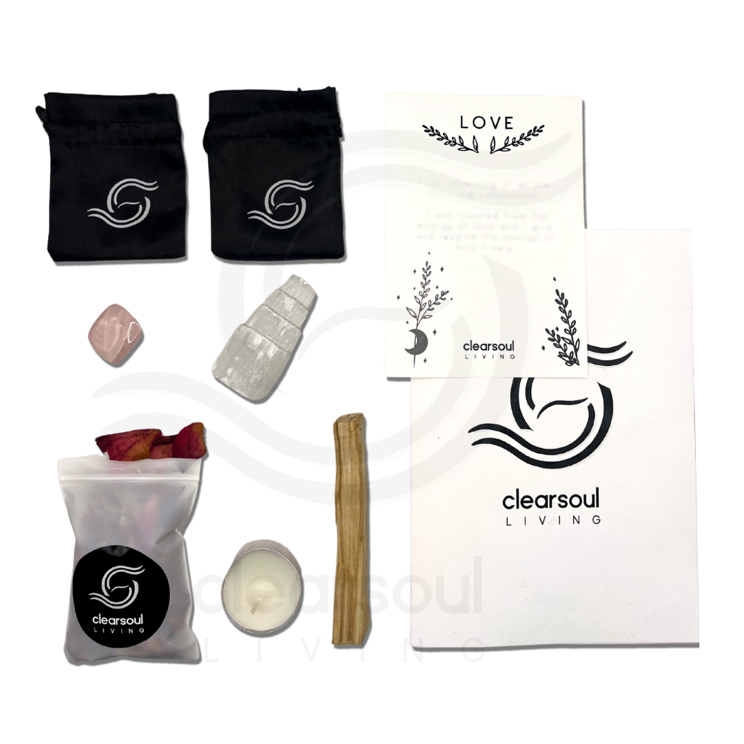 Complete Love Kit contents including Rose Quartz, Palo Santo, Selenite Tower, affirmation card, soy candle, crystal pouch, dried rose petals and ritual guide.