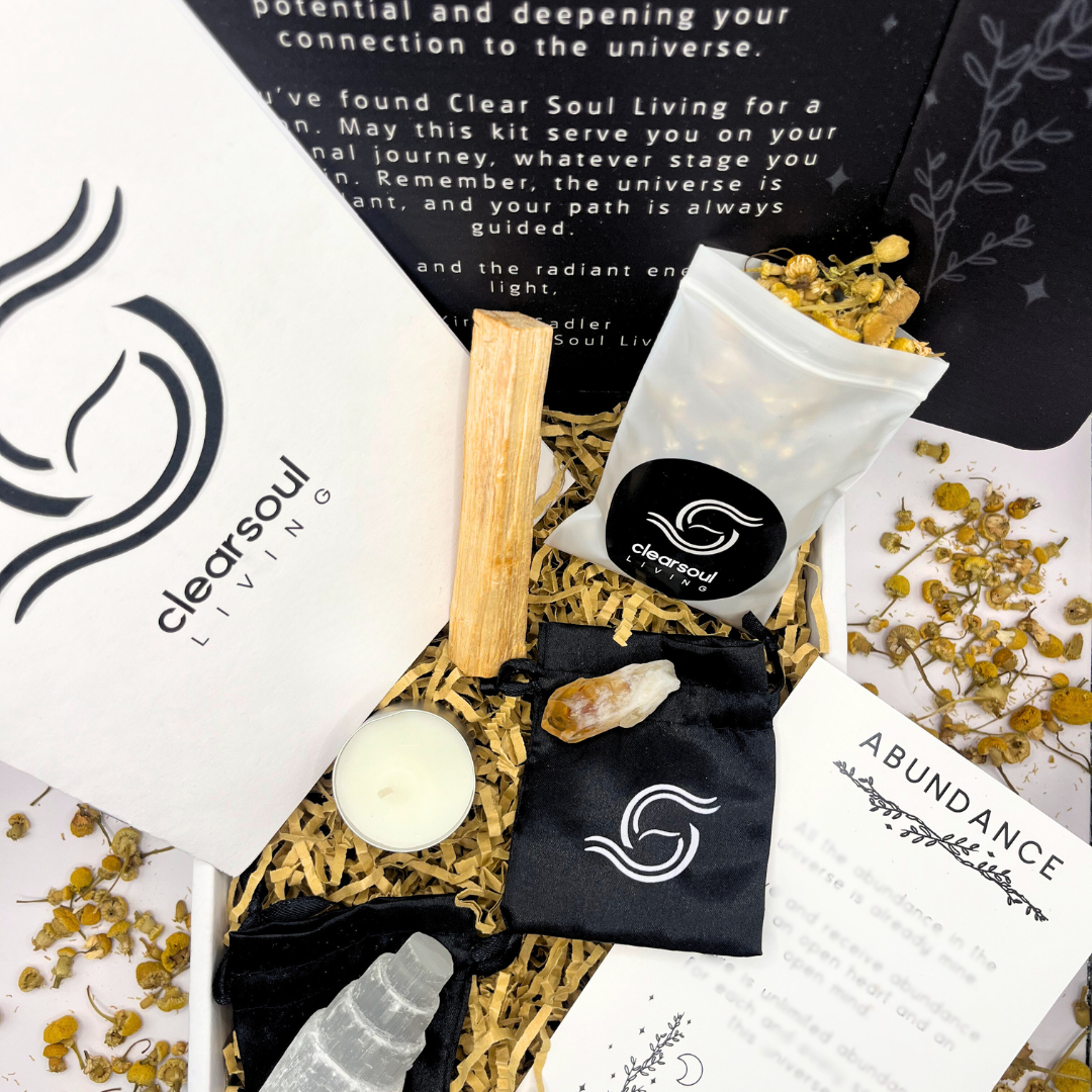 Abundance Kit with Citrine crystal, Palo Santo, Selenite Tower and dried chamomile. Designed for manifesting prosperity and attracting wealth. Clear Soul Living packaging.