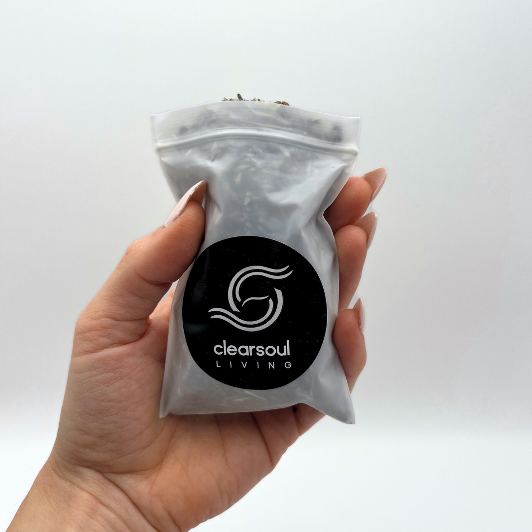 Clear Soul Living pouch filled with dried lavender flowers, known for their calming energy and support in stress relief.