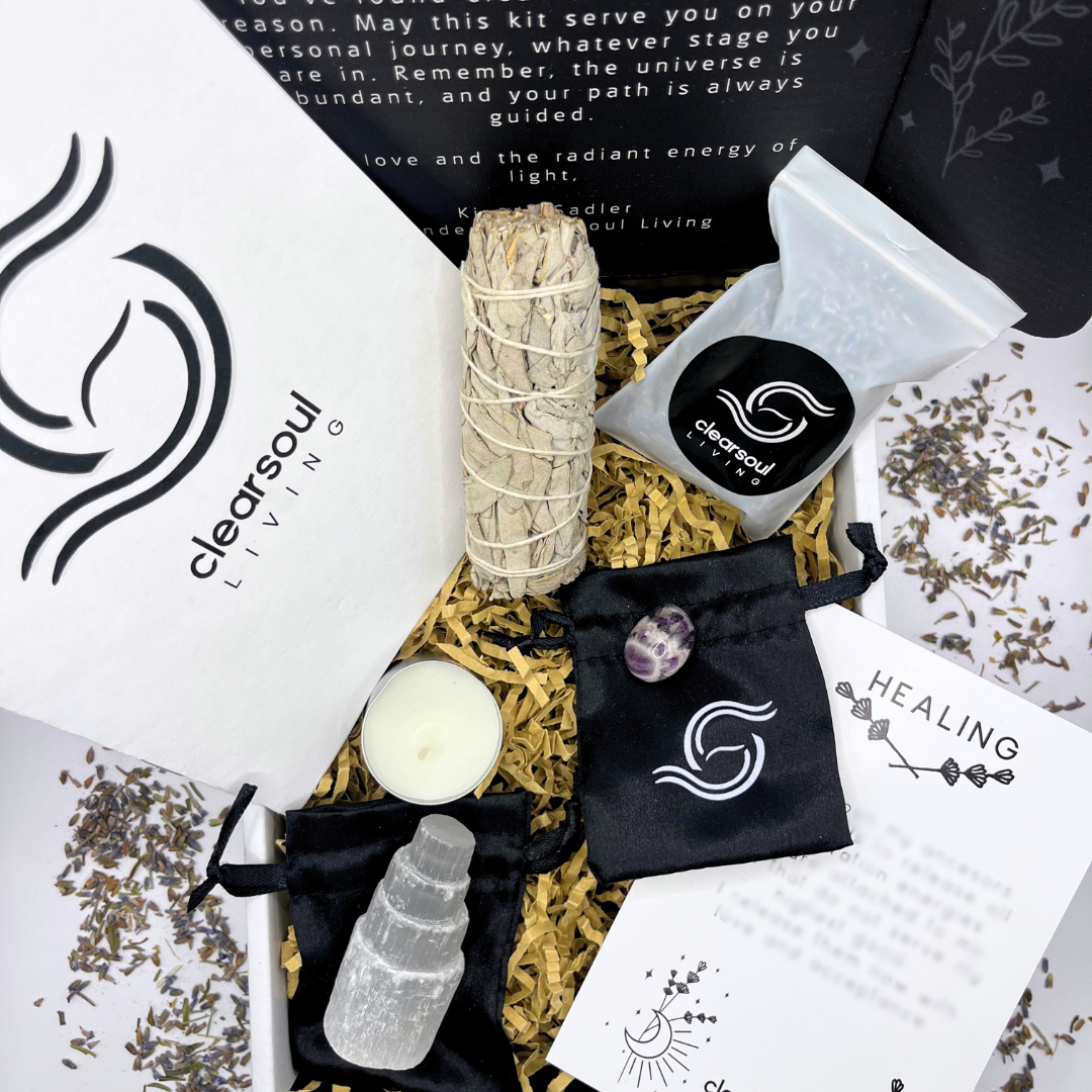 Healing Kit for emotional healing and inner peace featuring Amethyst, Selenite Tower, White Sage Smudge Stick, affirmation card, and lavender flowers in Clear Soul Living packaging