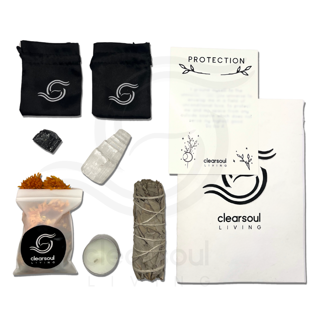 Complete Protection Kit contents including Black Tourmaline, White Sage smudge stick, Selenite Tower, crystal pouch, affirmation card, soy candle and ritual guide.